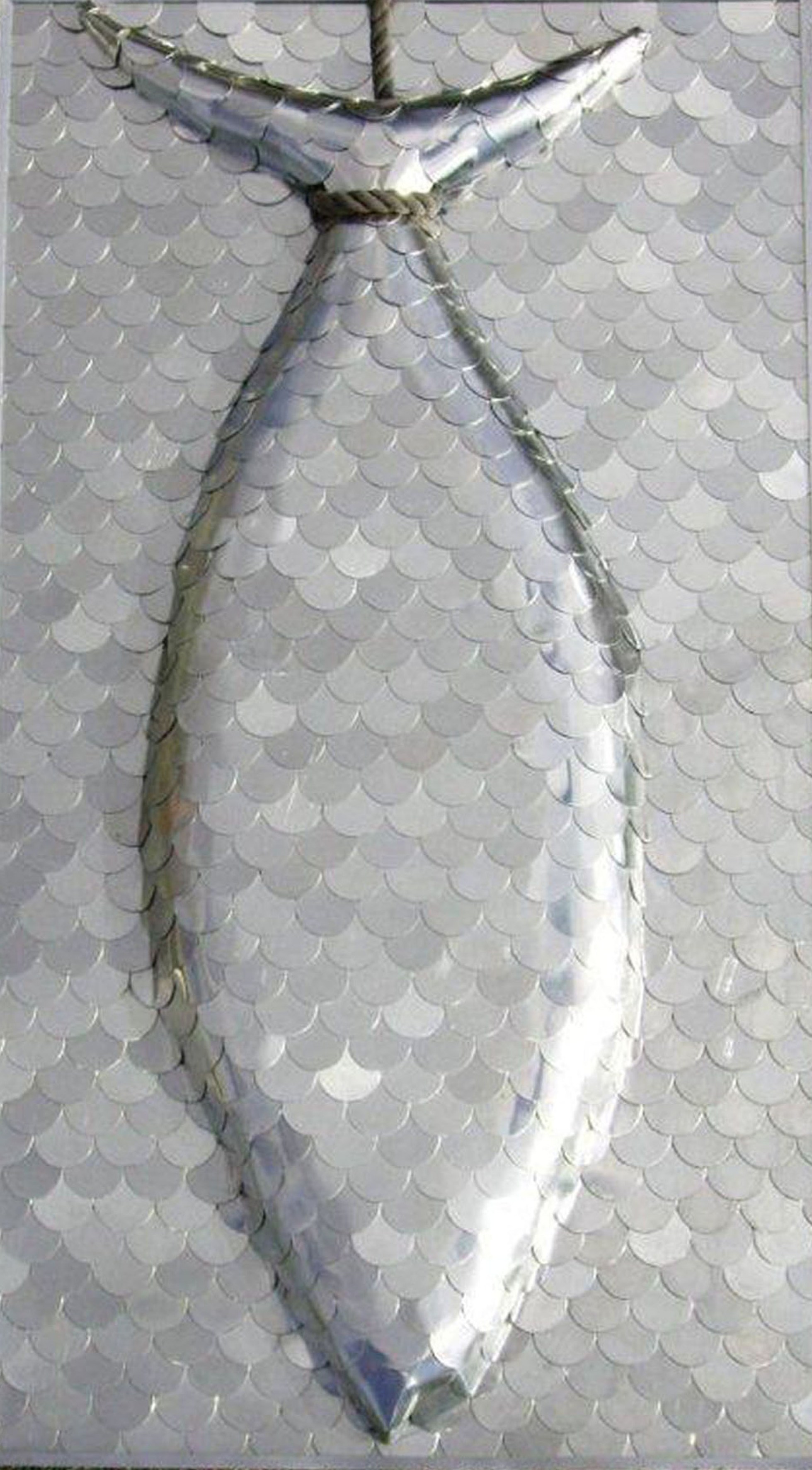 wall based sculpture made from 100's of aluminium discs covering a fish shape made from hebel and wood by artist marie jonsson harrison